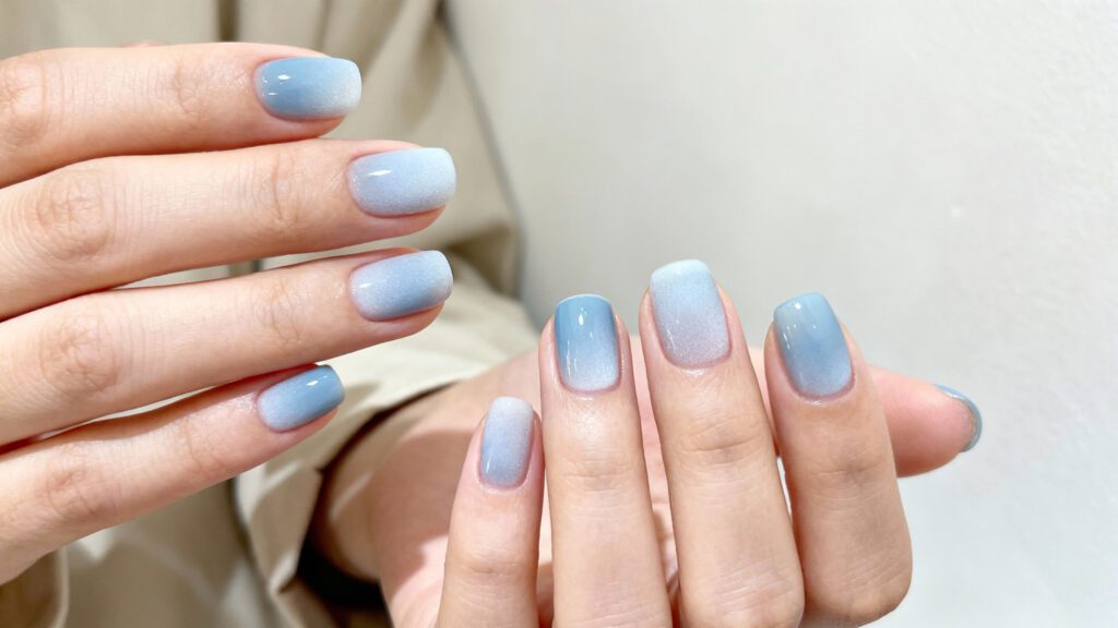 Simple icy blue nails with a clean minimal design