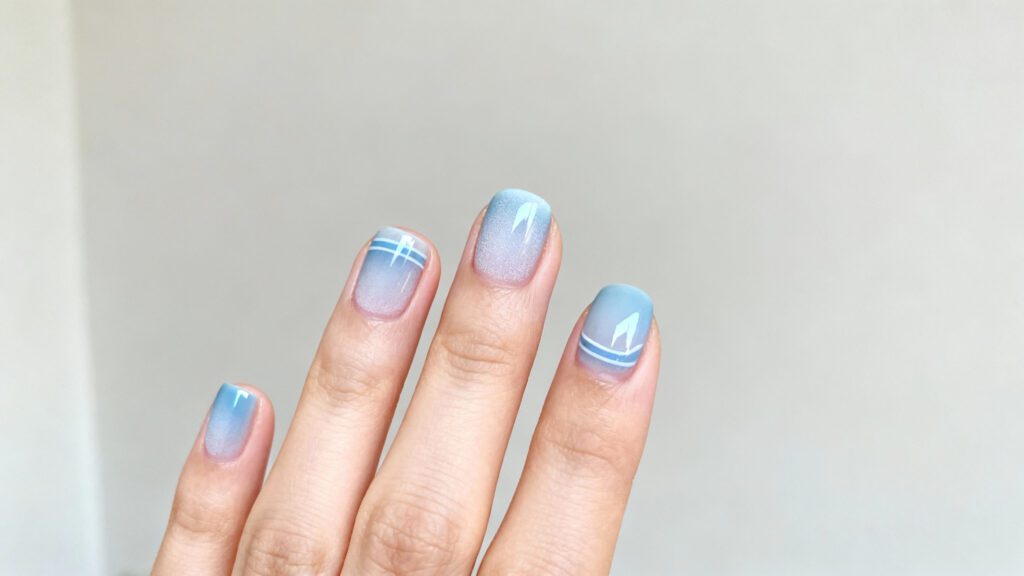 Simple icy blue nails with a clean minimal design